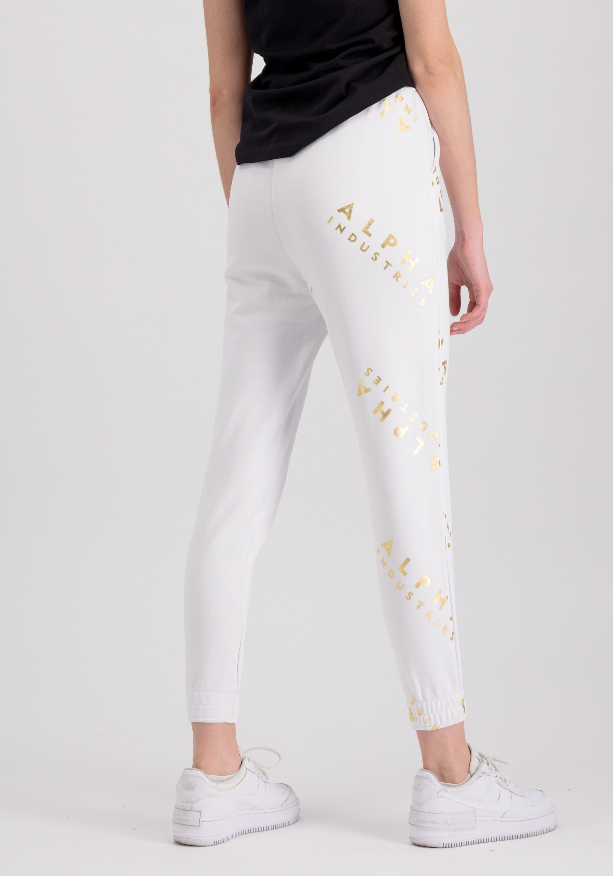 Alpha Industries Leg Foil Allover Print Jogger Women white/yellow gold 106050FP_590_alpha_industries_ai_leg_jogger_foil_aop_wmn_005_123239